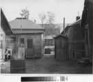 photo-of-outhouse-between-two-shack-houses